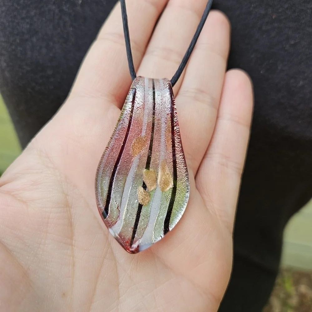 striped art glass pendant on black cord